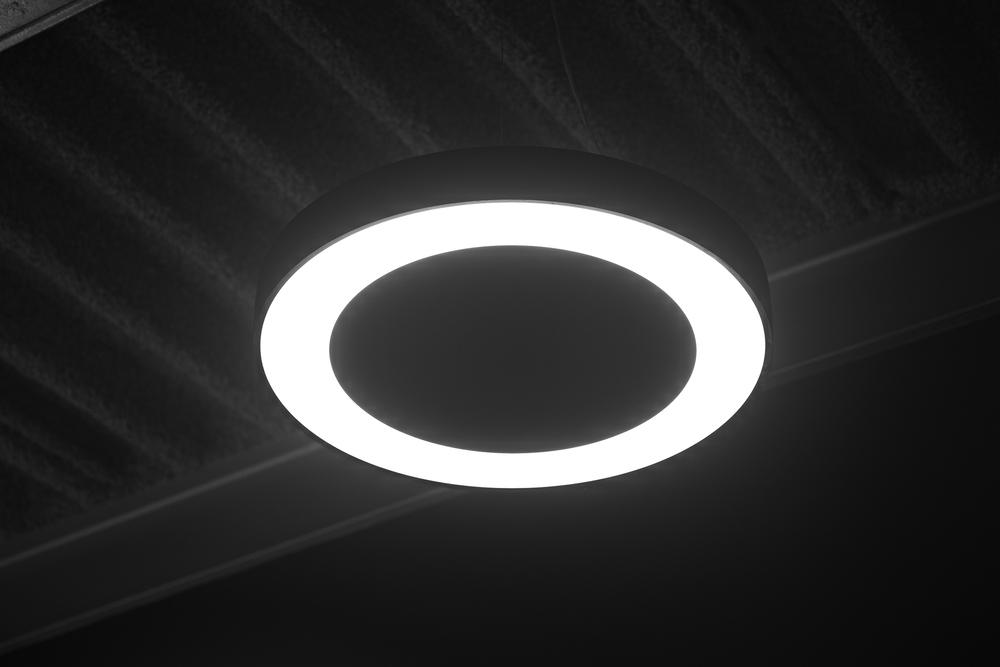 Circular ceiling light in an Acosorb acoustic interior