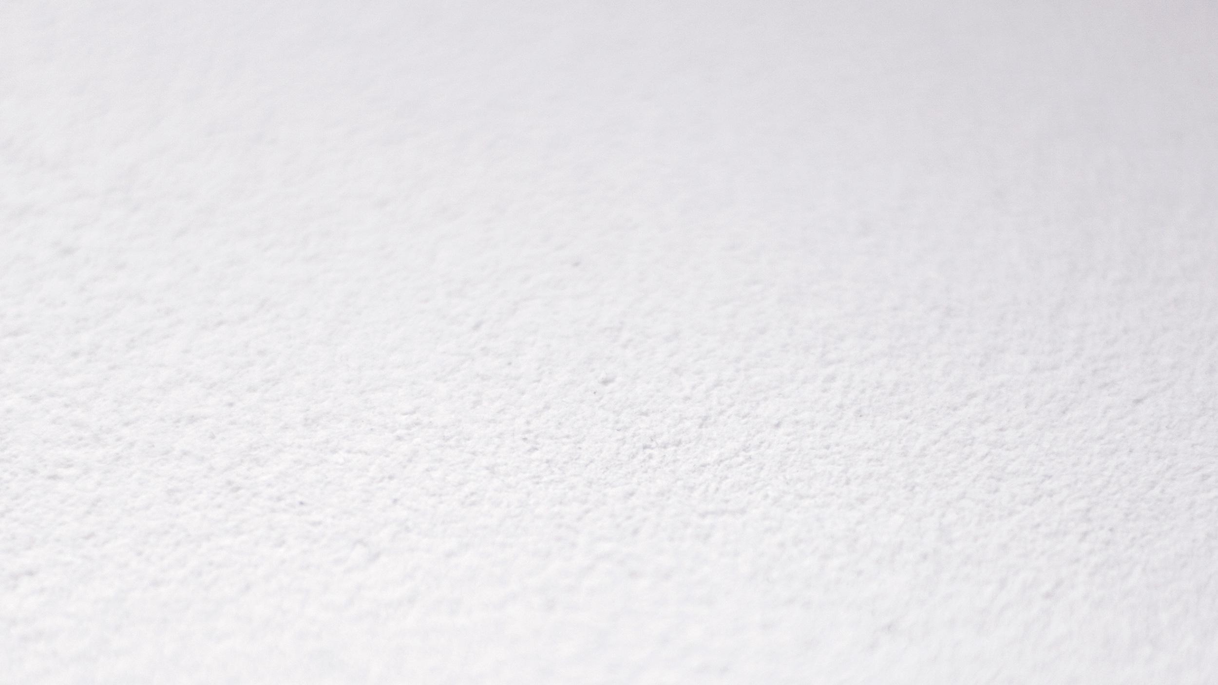 Close-up product shot of Acosorb white acoustic panel texture