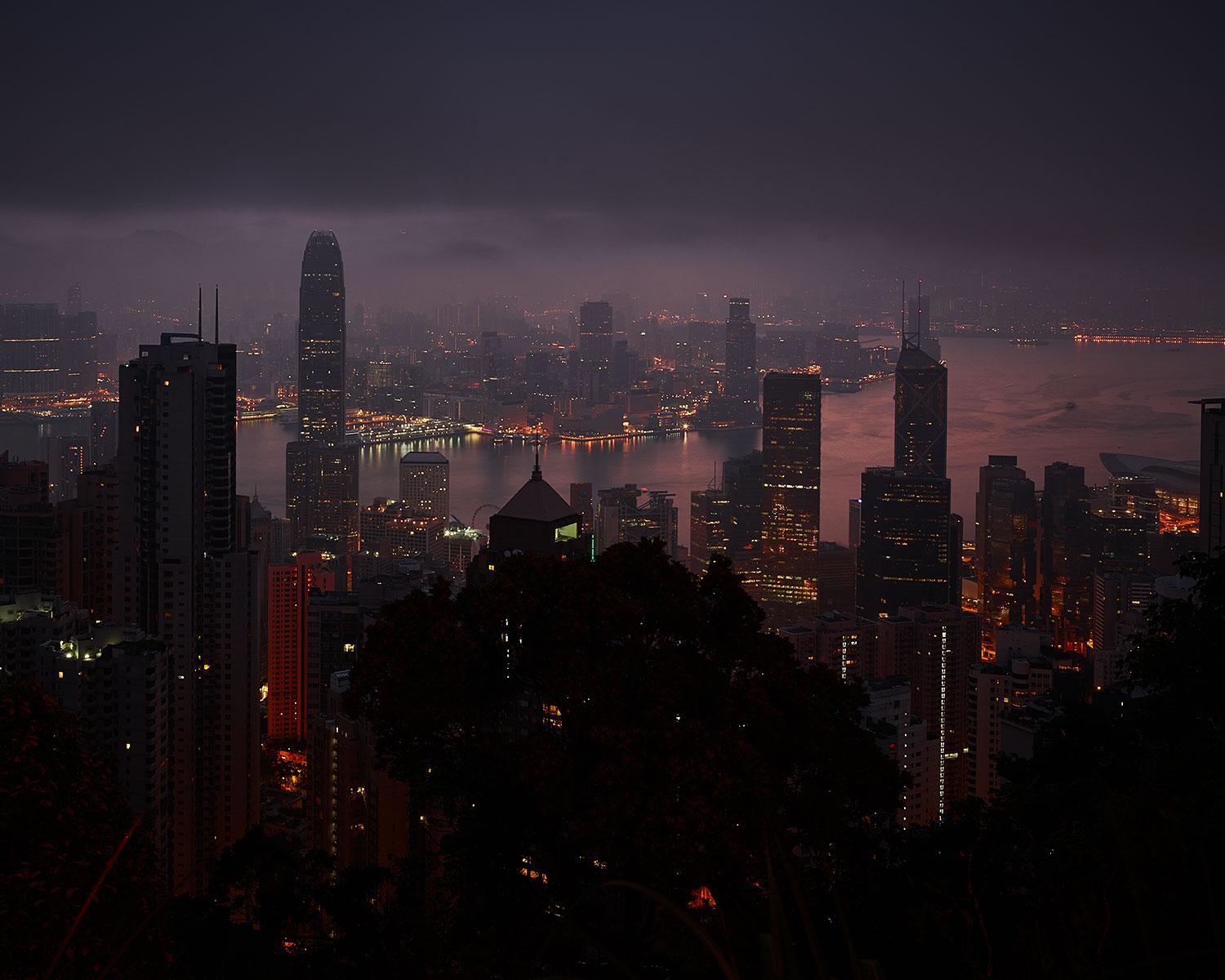 Bird’s-eye view of a modern city skyline with skyscrapers at dusk