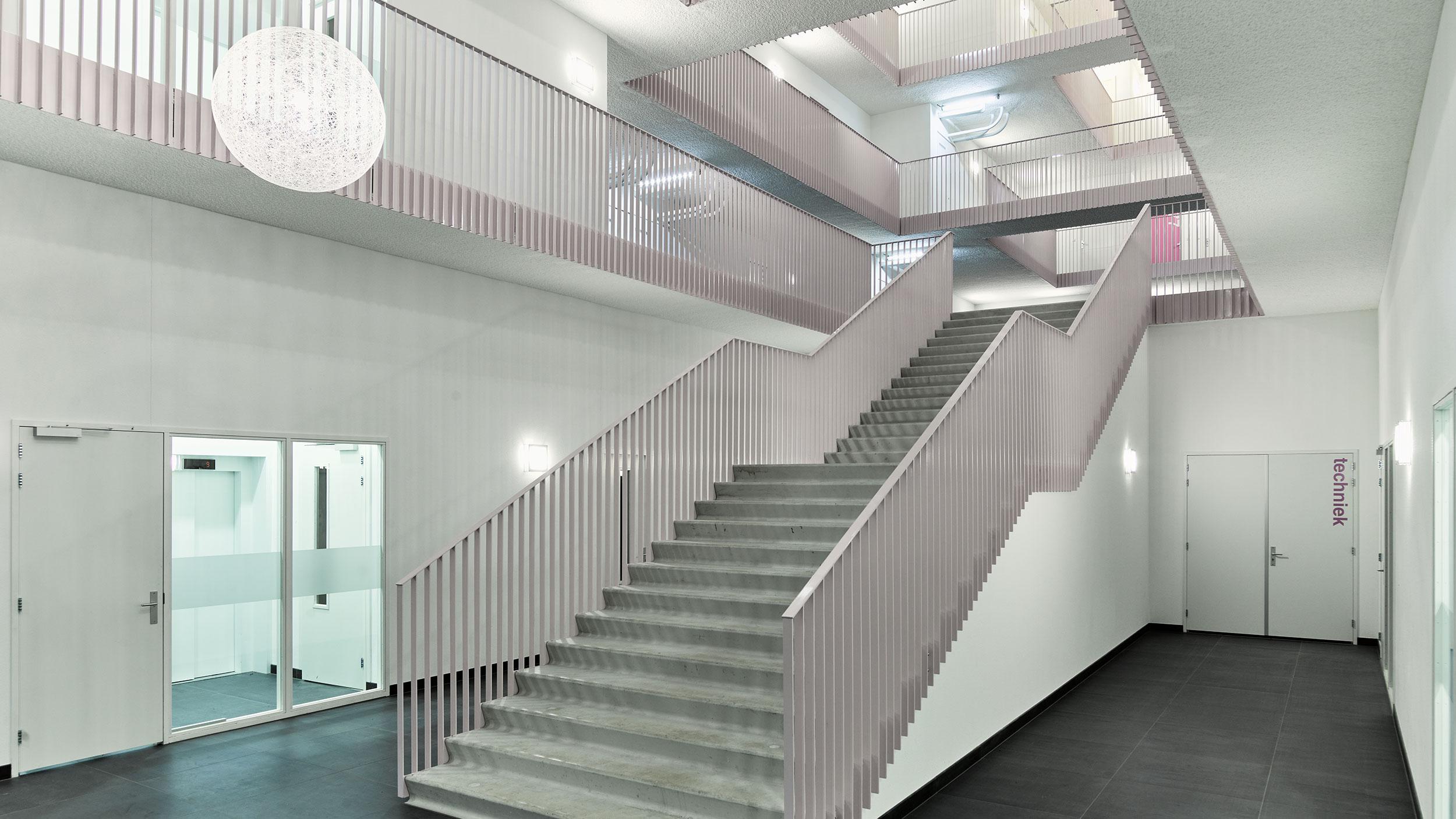 Staircase in a modern building with Acosorb acoustic ceiling and wall solutions
